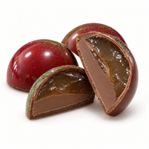 Caramel Apple Bon Bons, colored red and green like a changing apple and filled with housemate applesauce, caramel and ganache.