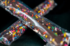 Two Packs of Chocolate Covered Pretzel Rods with Sprinkles