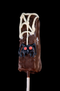 Brownie Pop close-up showing the chocolate coating over the brownie and the colorful icing decoration.