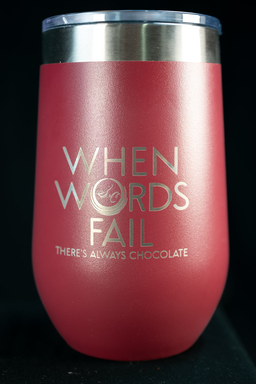 Pink stainless steel insulated tumbler engraved 'When Words Fail There's Always Chocolate' with The Secret Chocolatier monogram.