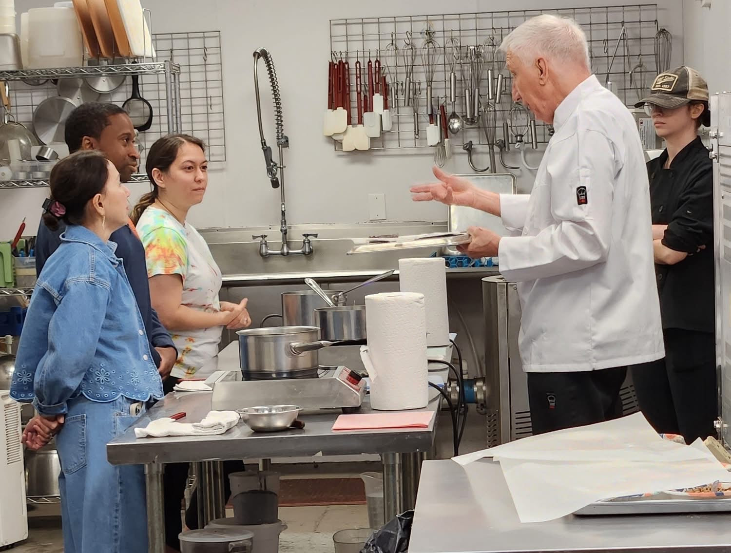 Chef Bill Dietz instructing participants during a hands-on chocolate truffle-making workshop at The Secret Chocolatier in Charlotte, NC.