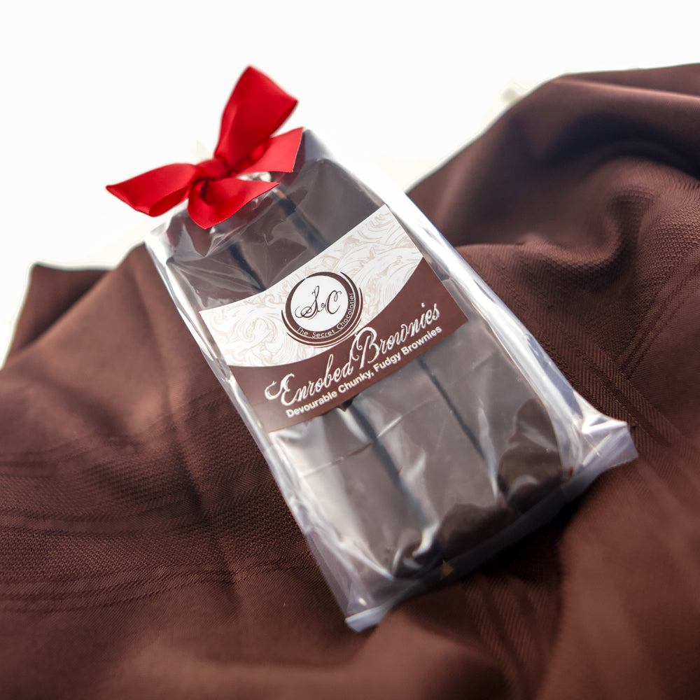 TSC Enrobed Brownies pack with red ribbon, part of the Tea & Chocolate Indulgence Kit.