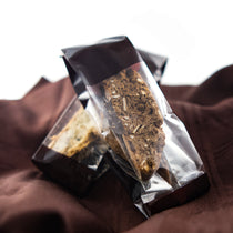TSC biscotti in cellophane packs, part of the Tea & Chocolate Indulgence Kit.