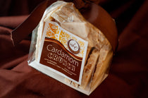Cardamom Crunch — white chocolate bark with cardamom, mace, candied orange, and crunchy croquant pieces.