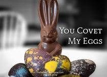 The Secret Chocolatier 'You Covet My Eggs' promotional graphic — a chocolate bunny standing in a pile of hand-painted speckled Easter eggs in purple, yellow, blue, and dark chocolate.