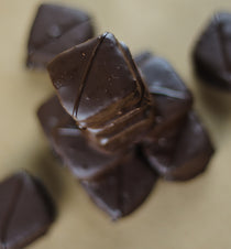 Chocolate Marshmallow cross-section view showing the fluffy marshmallow inside the dark chocolate shell.