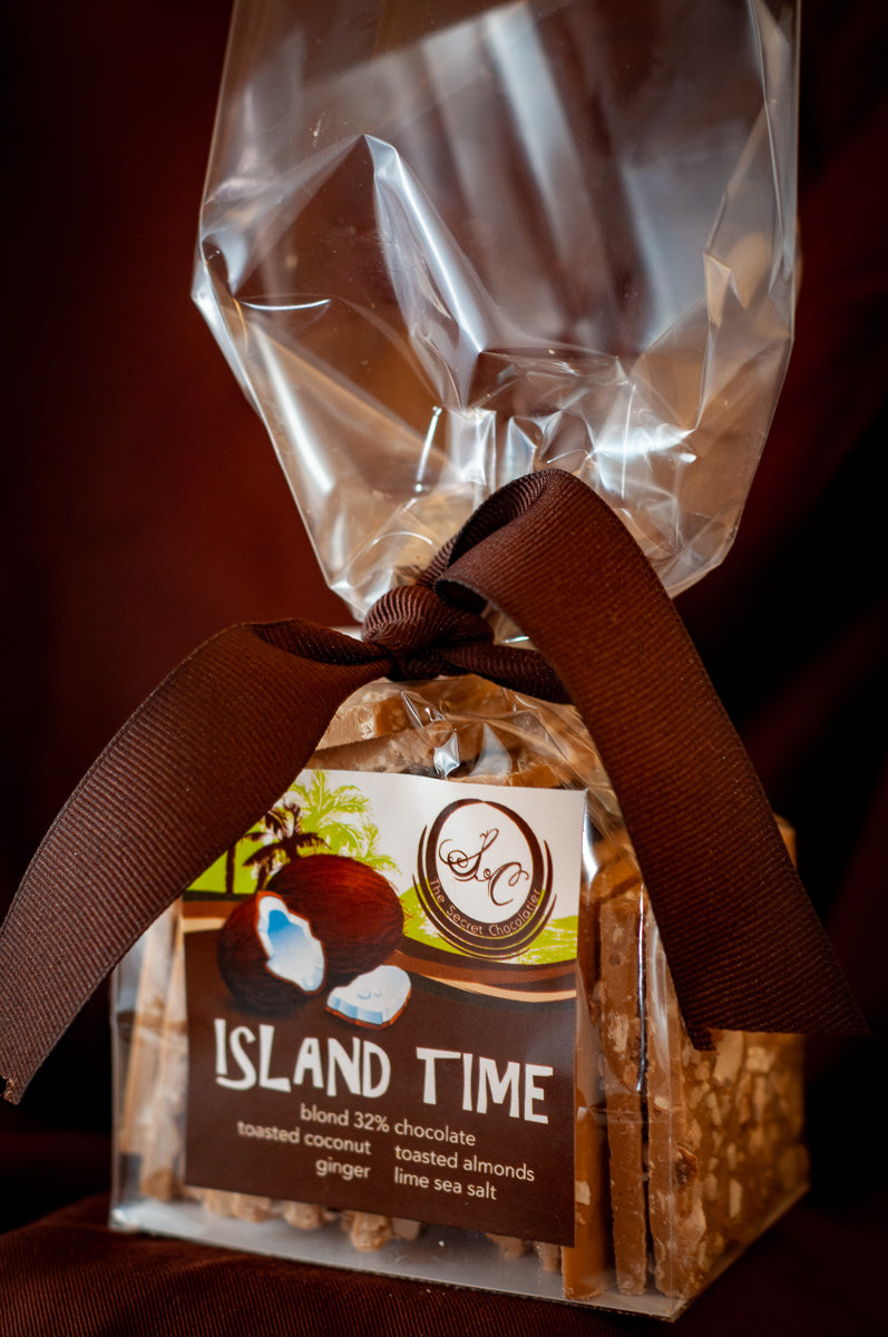 Island Time Bark slab from above, the nut-and-coconut top visible across the chocolate.