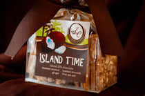 Close-up of Island Time Bark showing the nut and coconut pieces against the chocolate.