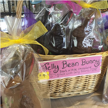 Jelly Bean Bunny gift basket — basket of cellophane-wrapped chocolate Easter bunnies with the Jelly Bean Bunny label.