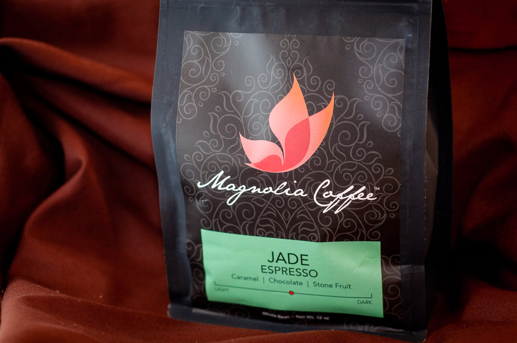 Magnolia Coffee Jade Espresso whole-bean bag — 12 oz, medium-dark roast with caramel, chocolate, and stone-fruit tasting notes — sold by The Secret Chocolatier.