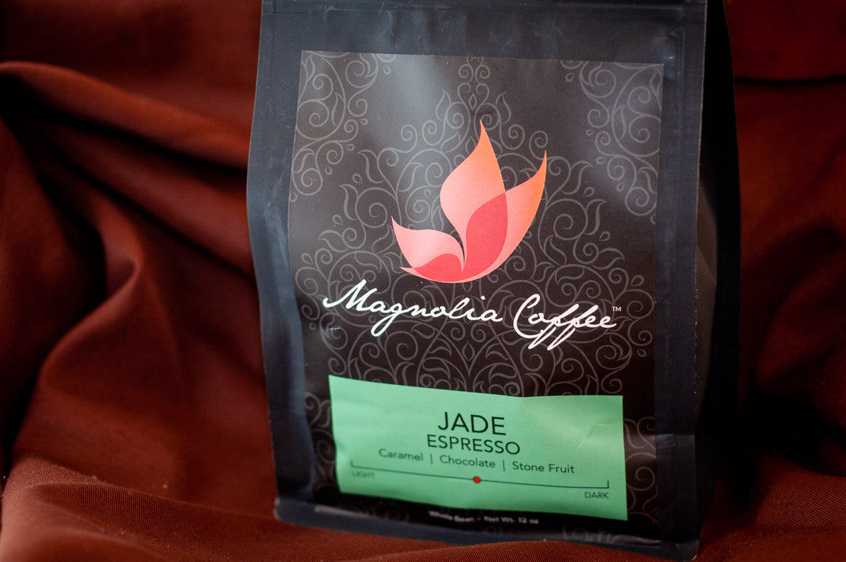 Magnolia Coffee Jade Espresso whole-bean bag — 12 oz, medium-dark roast with caramel, chocolate, and stone-fruit tasting notes — sold by The Secret Chocolatier.