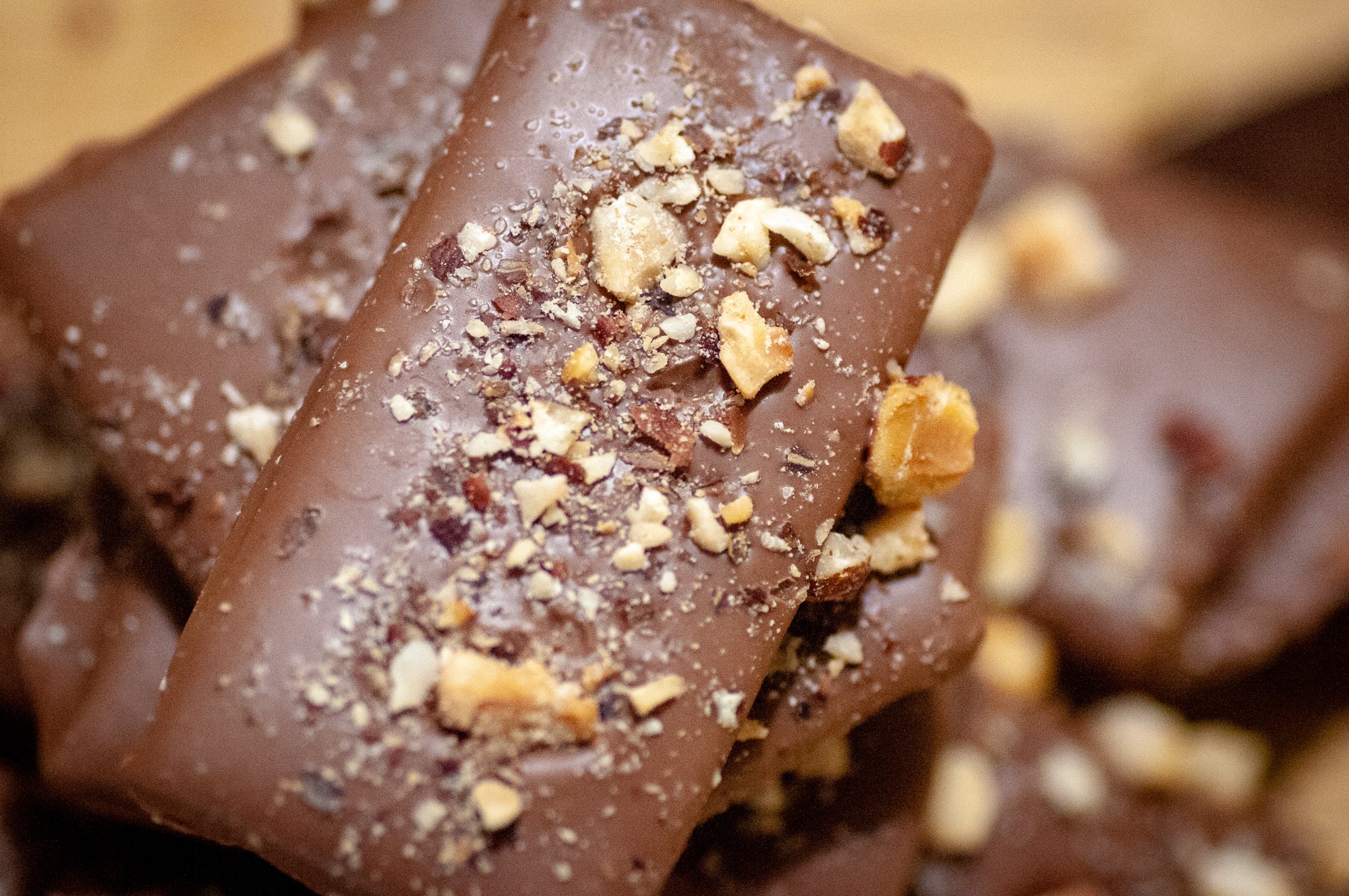 Milk Chocolate Hazelnut Butter Toffee pieces with the chopped-hazelnut topping in detail.