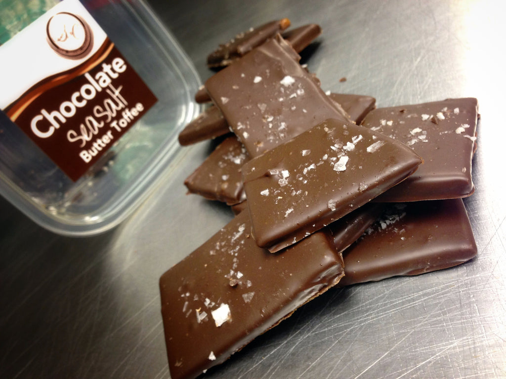 Sea Salt Chocolate Butter Toffee — dark chocolate-coated toffee slab finished with flaked sea salt.