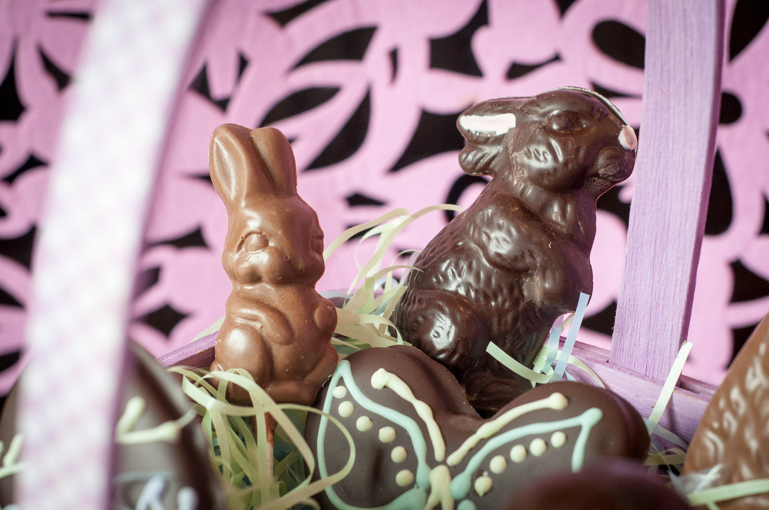Milk chocolate and dark chocolate Easter bunnies in the Large Chocolate Easter Basket with the piped chocolate butterfly in front.