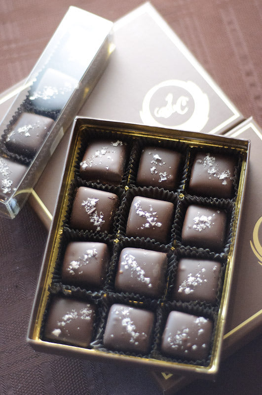 Dark Chocolate Caramels with Sea Salt at angle, showing the chocolate shell and sea-salt finish on each piece.