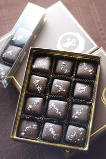 Dark Chocolate Caramels with Sea Salt at angle, showing the chocolate shell and sea-salt finish on each piece.