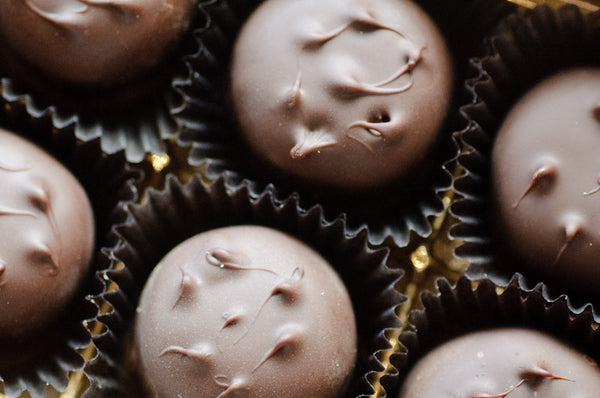 Peanut Butter Porcupines stacked together, the dark chocolate domes side by side.