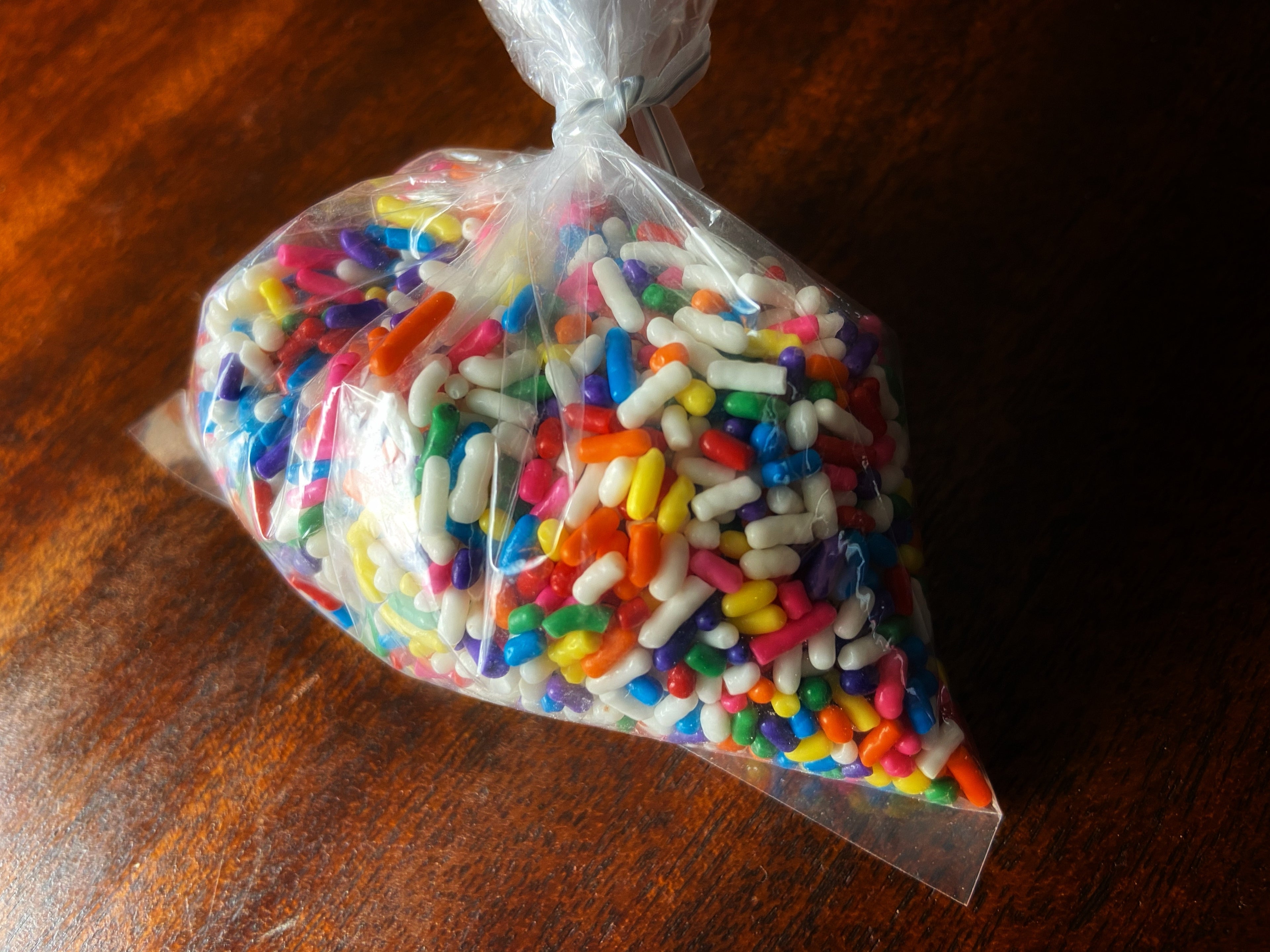 Brownie Pop Decorating Kit sprinkles — bag of rainbow sprinkles for decorating.